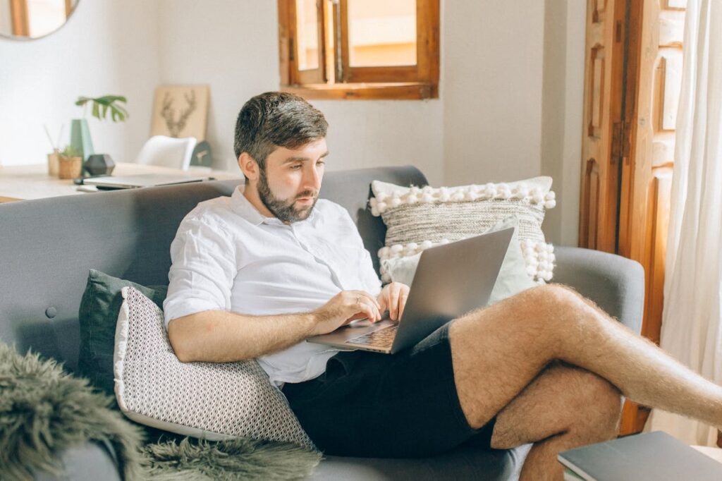 A Man Using a Laptop - Work From Home Jobs No Experience